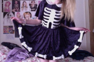 Whoever made this was a pure genius! This dress was almost created for the pastel goth, goth, and grunge fashion styles. It's the perfect balance of tough gore filled bones and the cuteness a dress brings.
